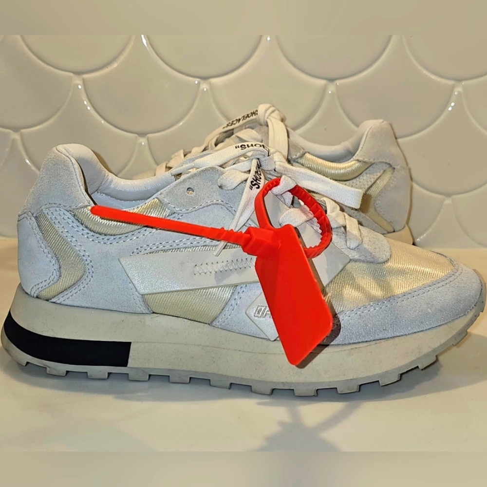 Off-White Sneakers with Red Tag